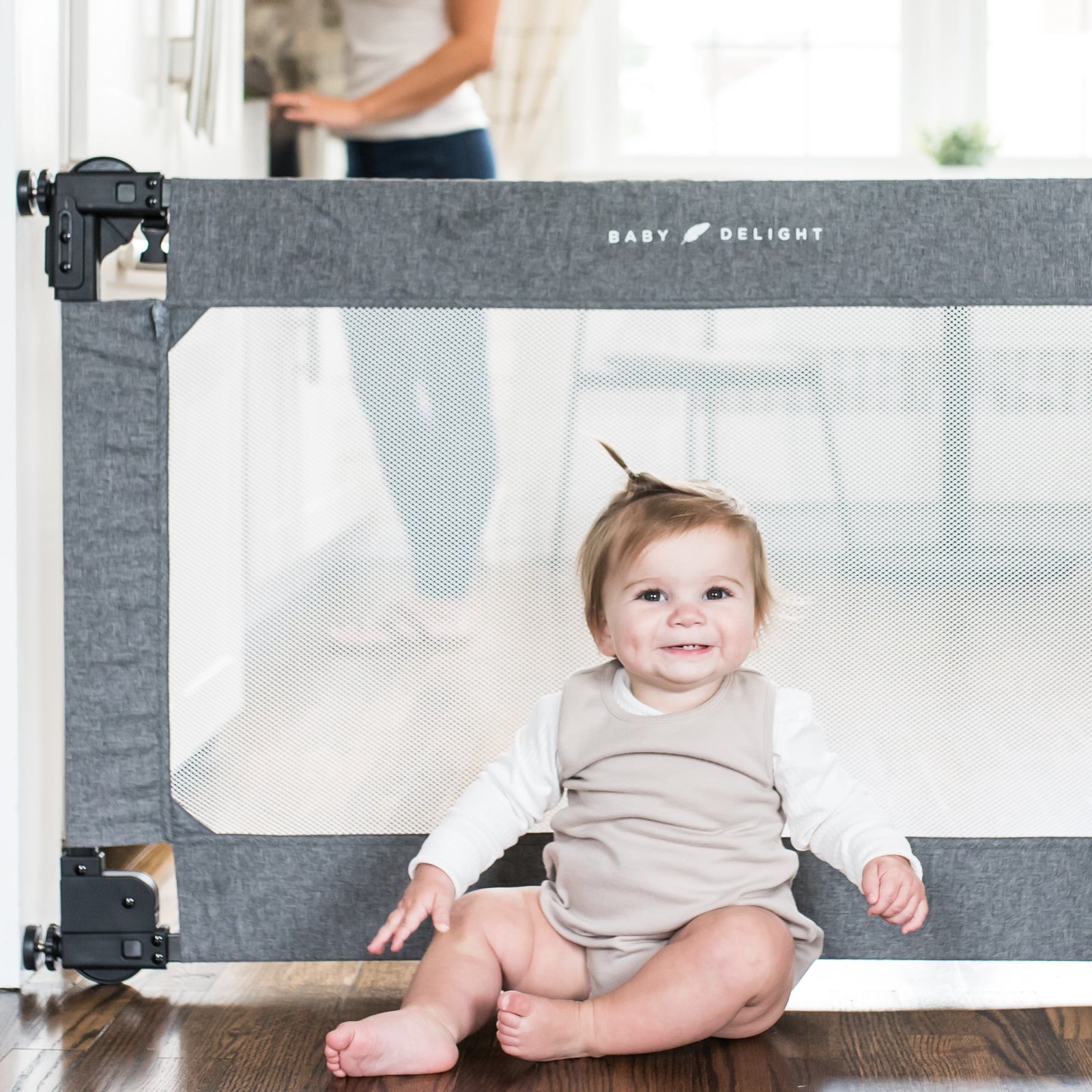 Baby gate that folds fashion into wall